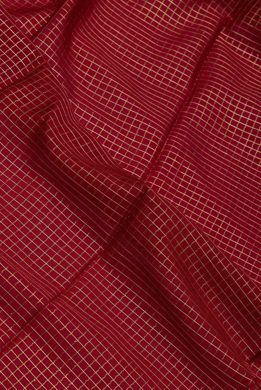 Close up of Maroon Mysore Silk Saree with Checked design on the body and Zari Border.  displaying folds