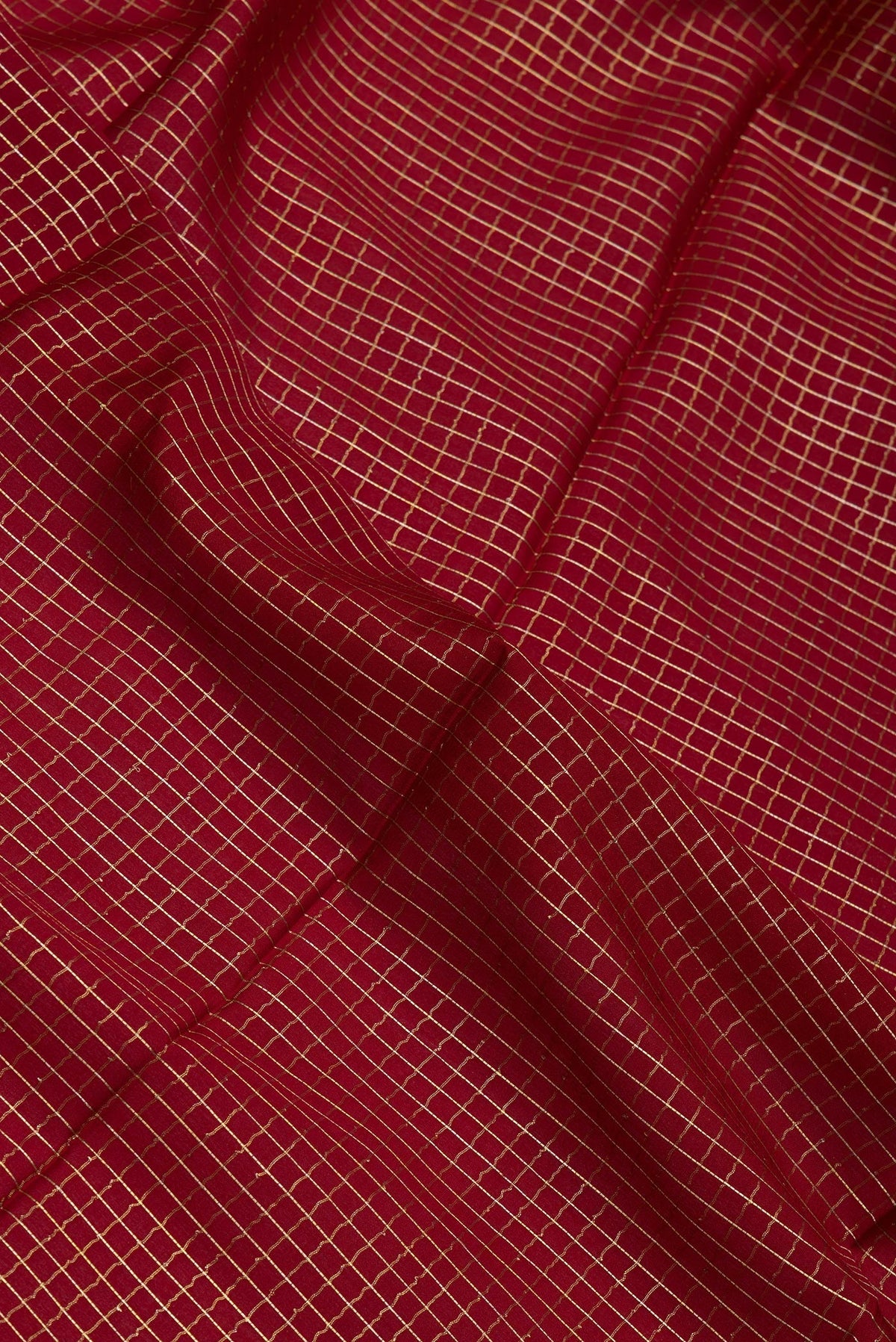 Close up of Maroon Mysore Silk Saree with Checked design on the body and Zari Border.  displaying folds