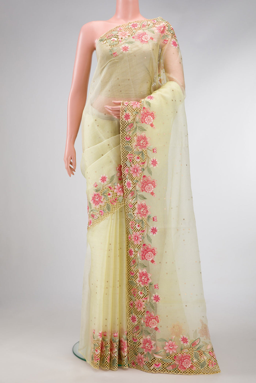 Lemon Yellow Dual Tone Organza Silk Saree with Embroidery on the body and Embroidery Border.  displayed on a mannequin