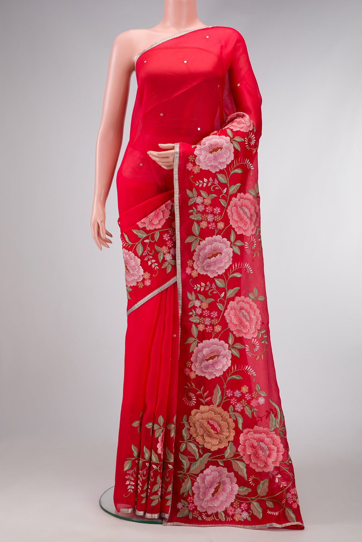 Red Dual Tone Organza Silk Saree with Zari Butta on the body and Embroidery Border.  displayed on a mannequin