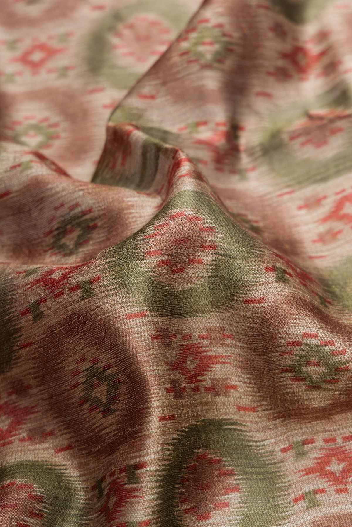 Close up of Dark Beige Dual Tone Tussar Silk Saree with Printed design on the body and Zari Border.  displaying folds
