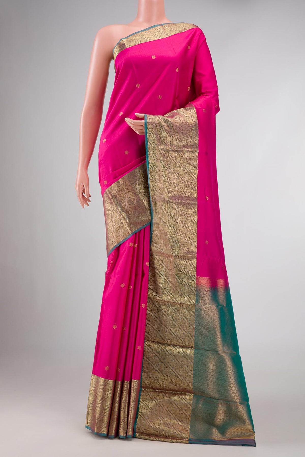 Pink Dual Tone Kanchipuram Silk Saree with Zari Butta on the body and Zari Border displayed on a mannequin