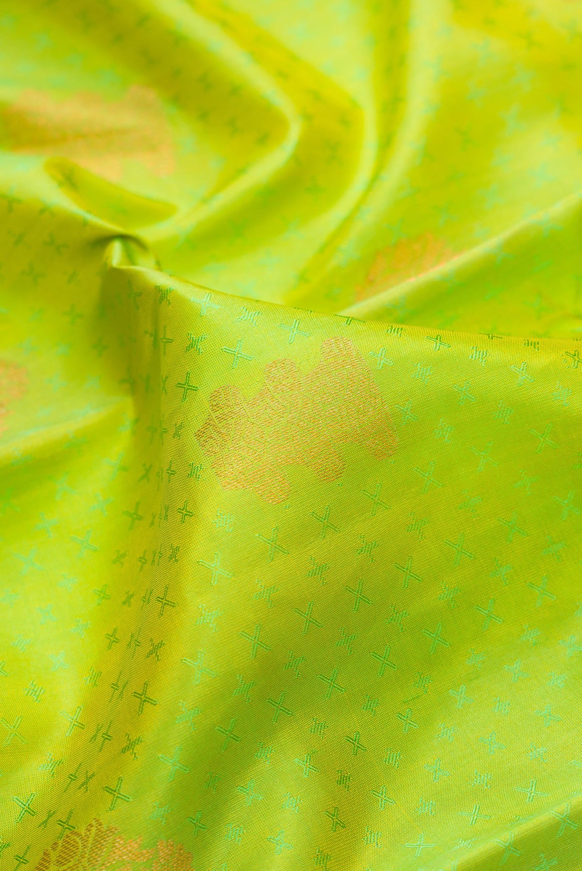 Close up of Parrot Green Dual Tone Kanchipuram Silk Saree with Jacquard With Zari Butta on the body and Zari Border.  displaying folds