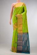 Parrot Green Dual Tone Kanchipuram Silk Saree with Jacquard With Zari Butta on the body and Zari Border.  displayed on a mannequin