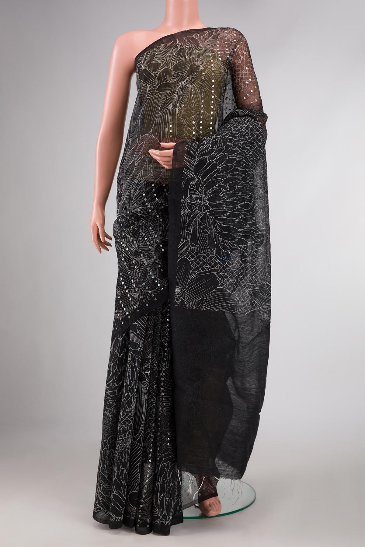 Black Dual Tone Tussar Silk Saree with Embroidery on the body and Without Border displayed on a mannequin