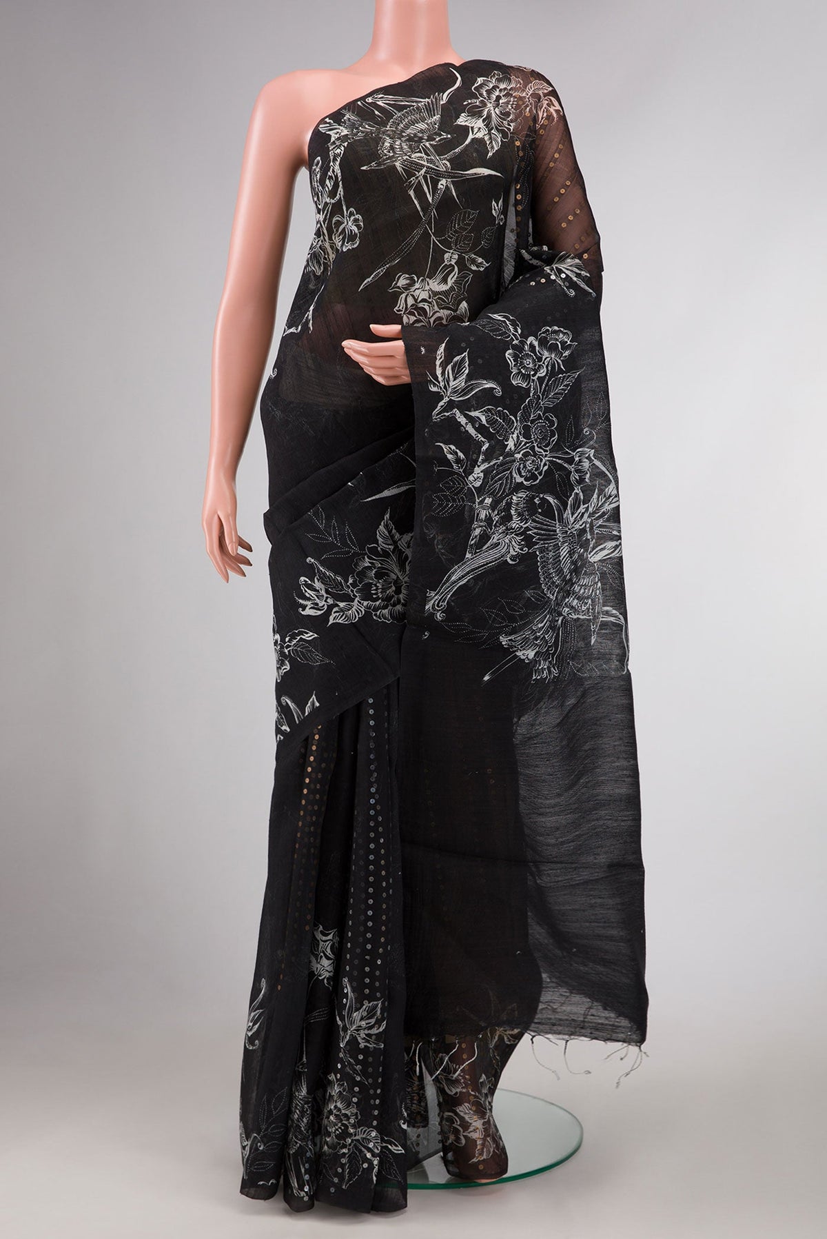 Black Dual Tone Tussar Silk Saree with Embroidery on the body and Printed Border displayed on a mannequin