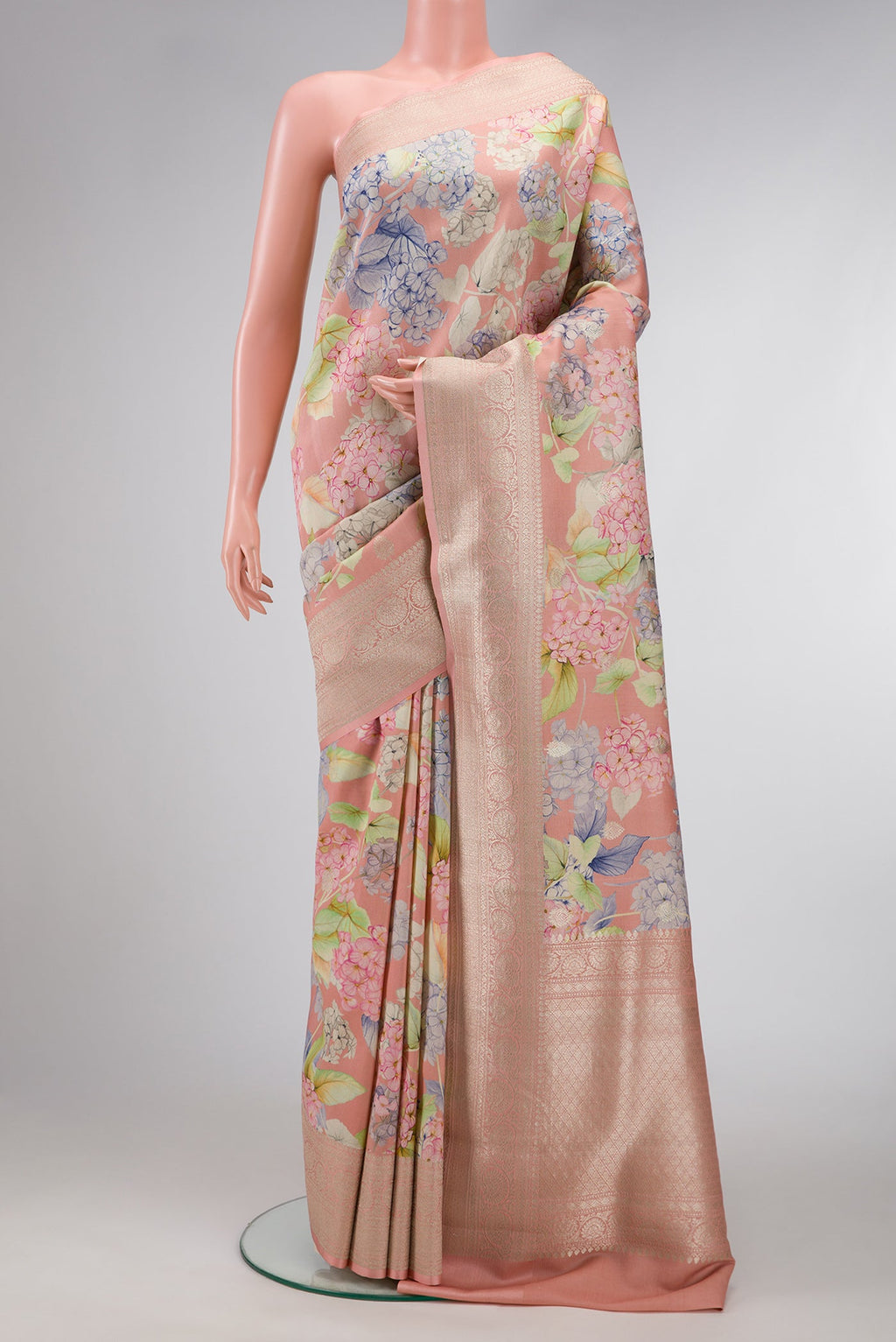 Rose Gold Dual Tone Tussar Silk Saree with Printed design on the body and Zari Border.  displayed on a mannequin