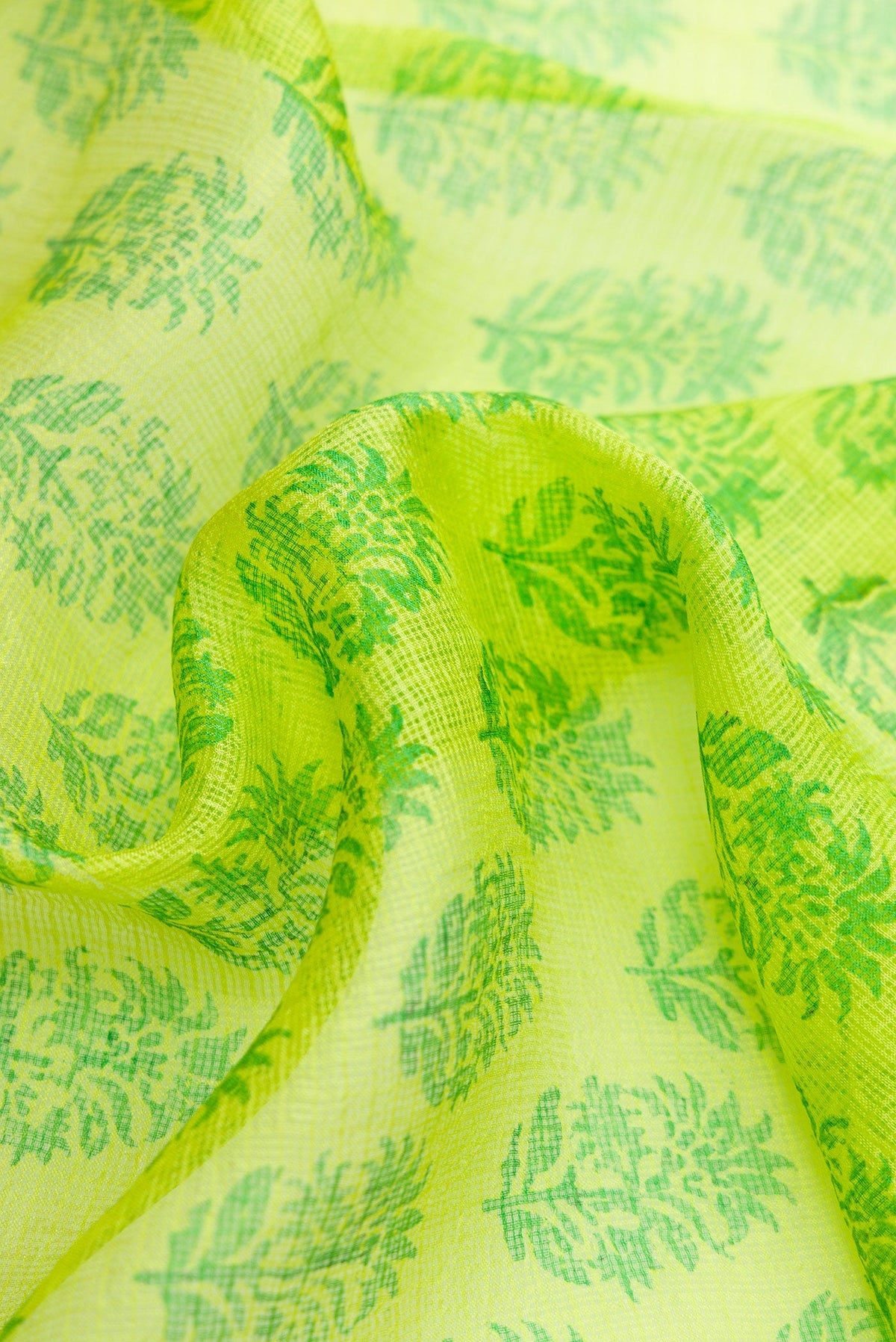 Close up of Parrot Green Dual Tone Kota Silk Saree with Printed design on the body and Zari Border.  displaying folds