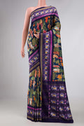 Navy Blue Dual Tone Kanchipuram Silk Saree with Printed design on the body and Ikat Border displayed on a mannequin