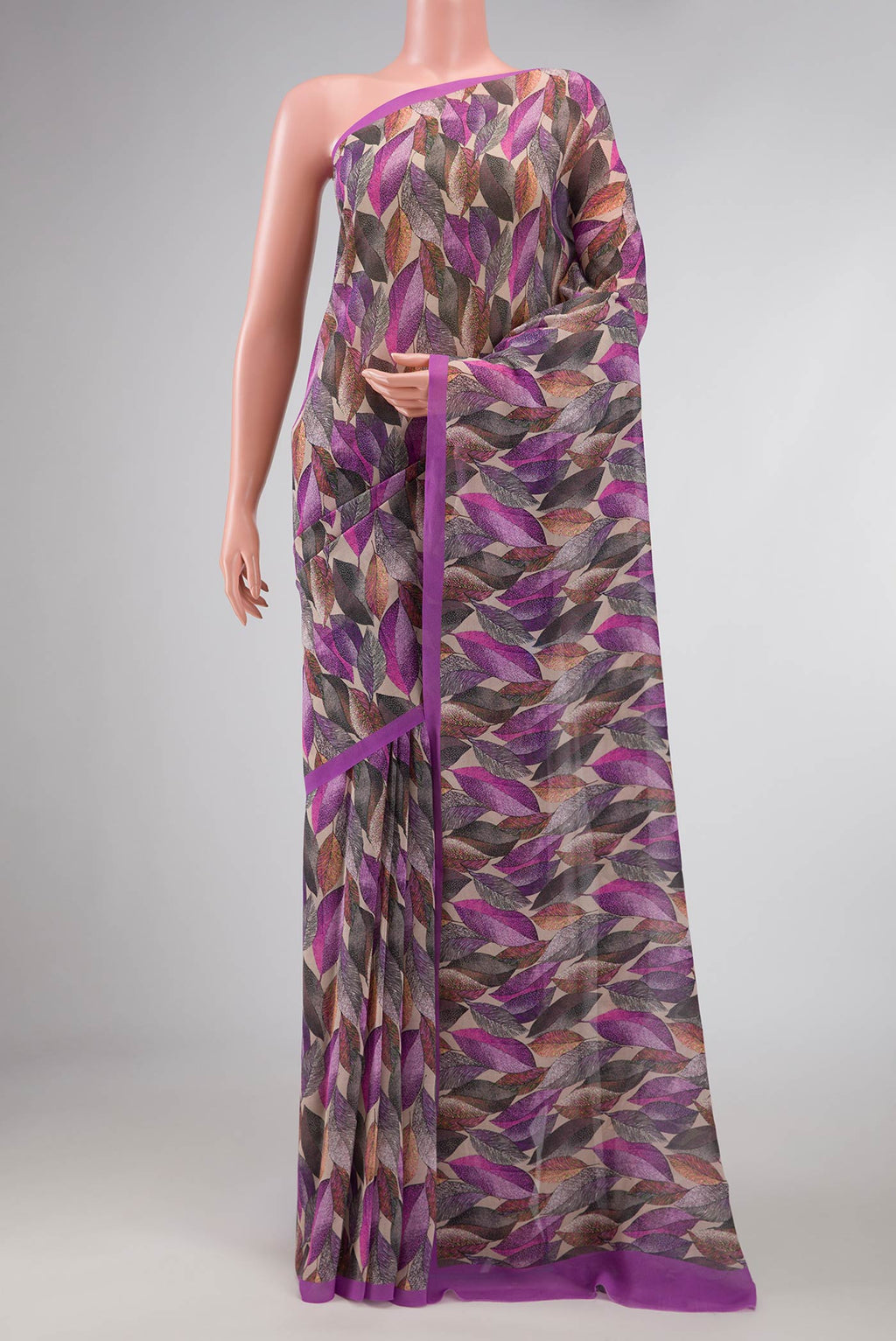 Lavender Dual Tone Mysore Georgette Saree with Printed design on the body and Plain Border displayed on a mannequin