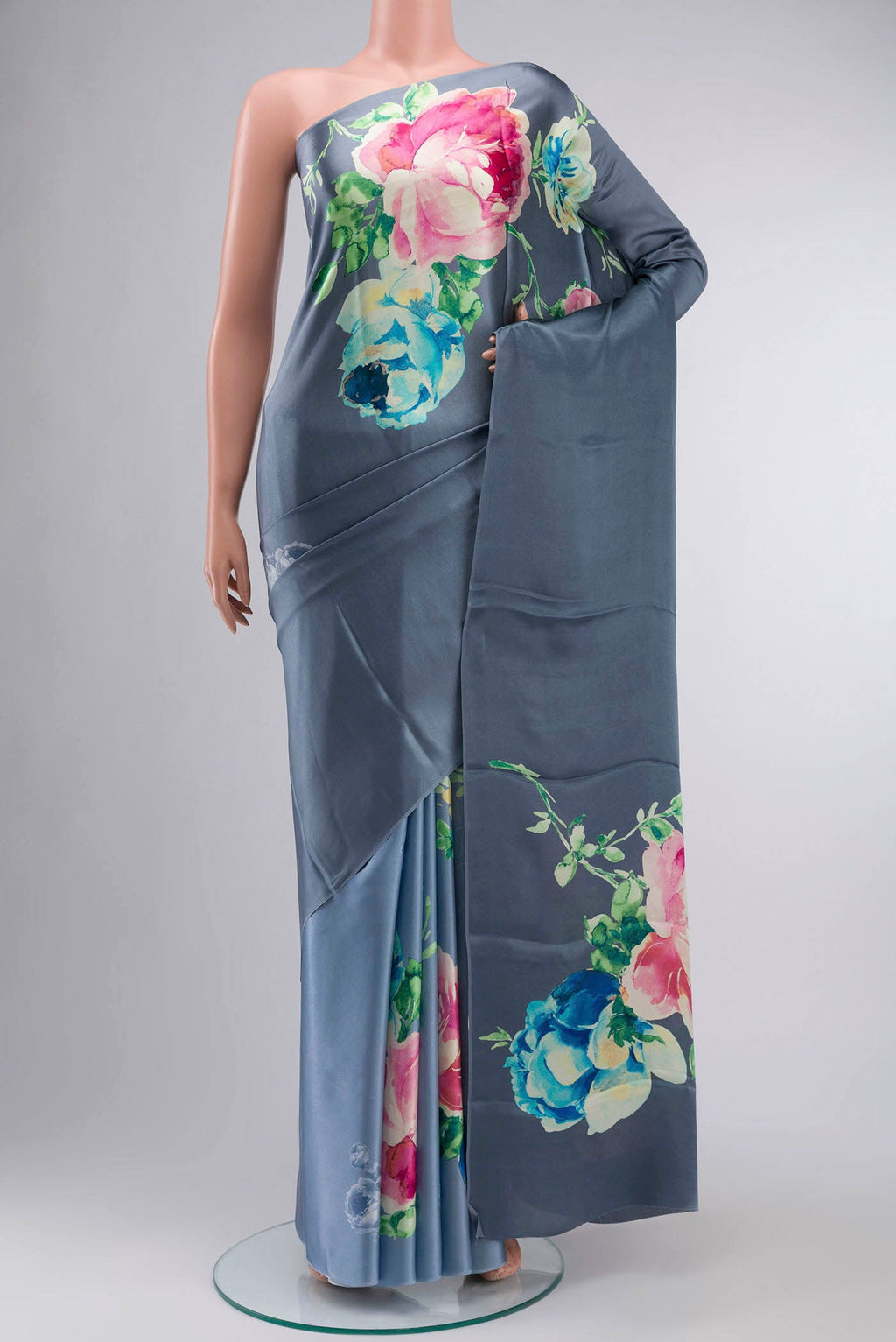 Blue Satin Crepe Saree Printed design on the body and Without Border displayed on a mannequin