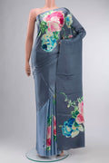Blue Satin Crepe Saree Printed design on the body and Without Border displayed on a mannequin