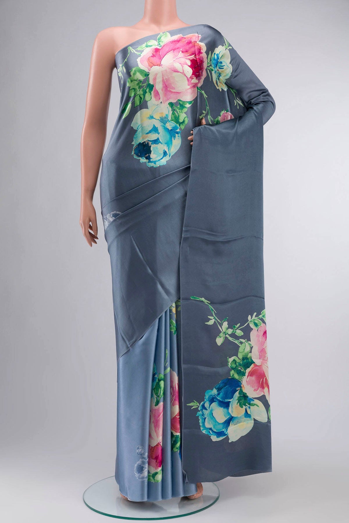 Blue Satin Crepe Saree Printed design on the body and Without Border displayed on a mannequin