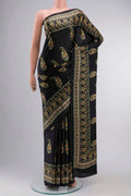 Black Satin Crepe Saree Printed design on the body and Plain Border displayed on a mannequin