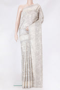 Grey Tussar Silk Saree with Printed design on the body and Printed Border.  displayed on a mannequin