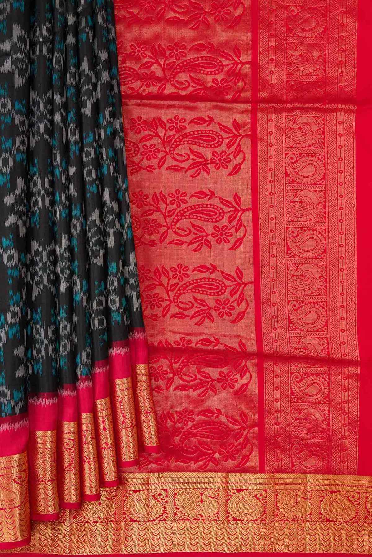 Pleats and pallu of Black Dual Tone Soft Silk Saree with Ikat Print on the body and Zari Border. 