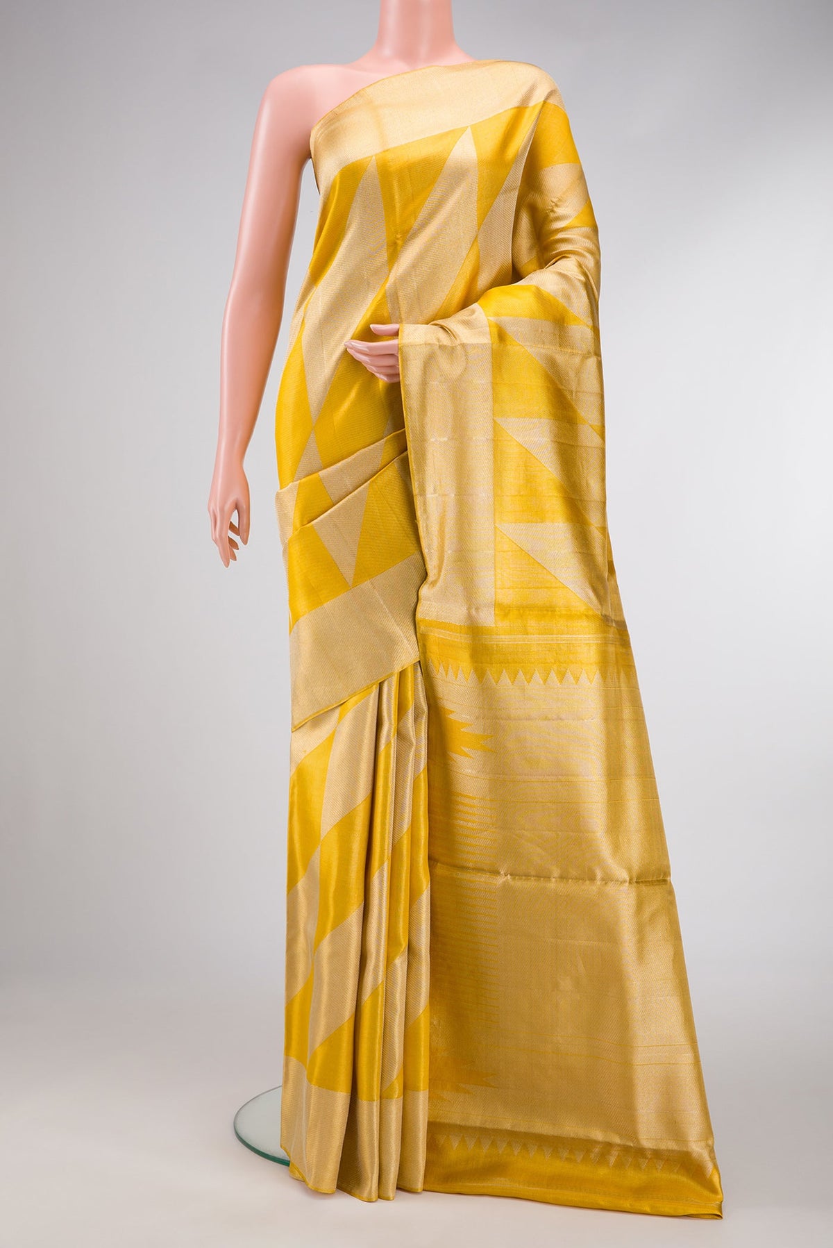 Gold Dual Tone Tissue Silk Saree with Zari Brocade on the body and Zari Border.  displayed on a mannequin