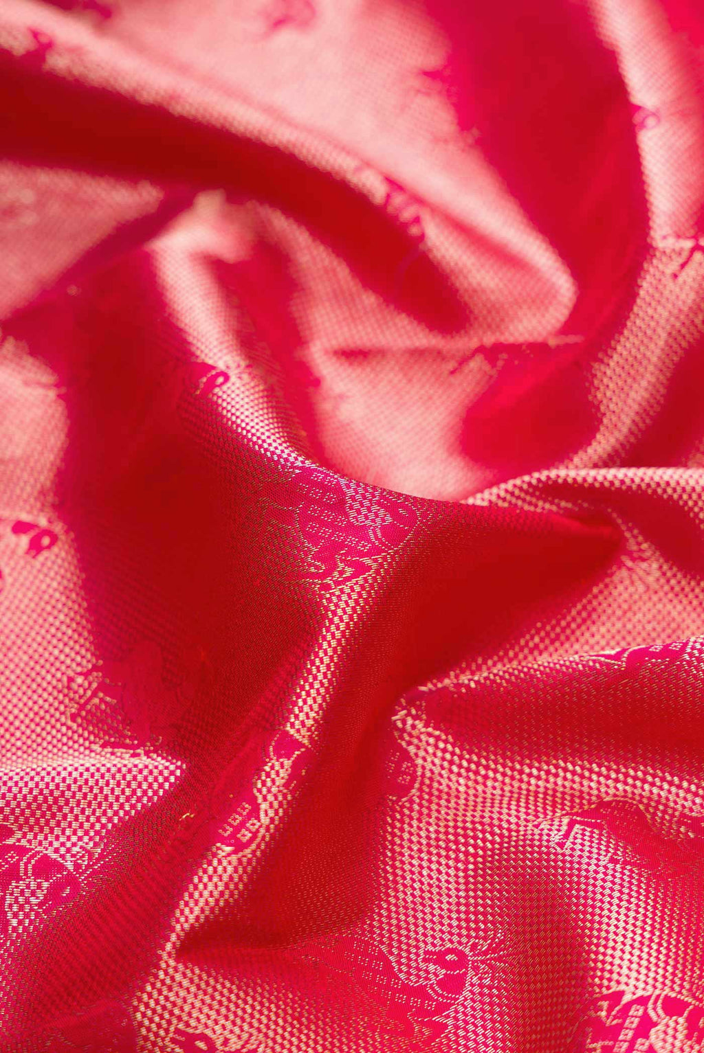 Close up of Dark Pink Dual Tone Kanchipuram Silk Saree with Zari Brocade on the body and Zari Border displaying folds
