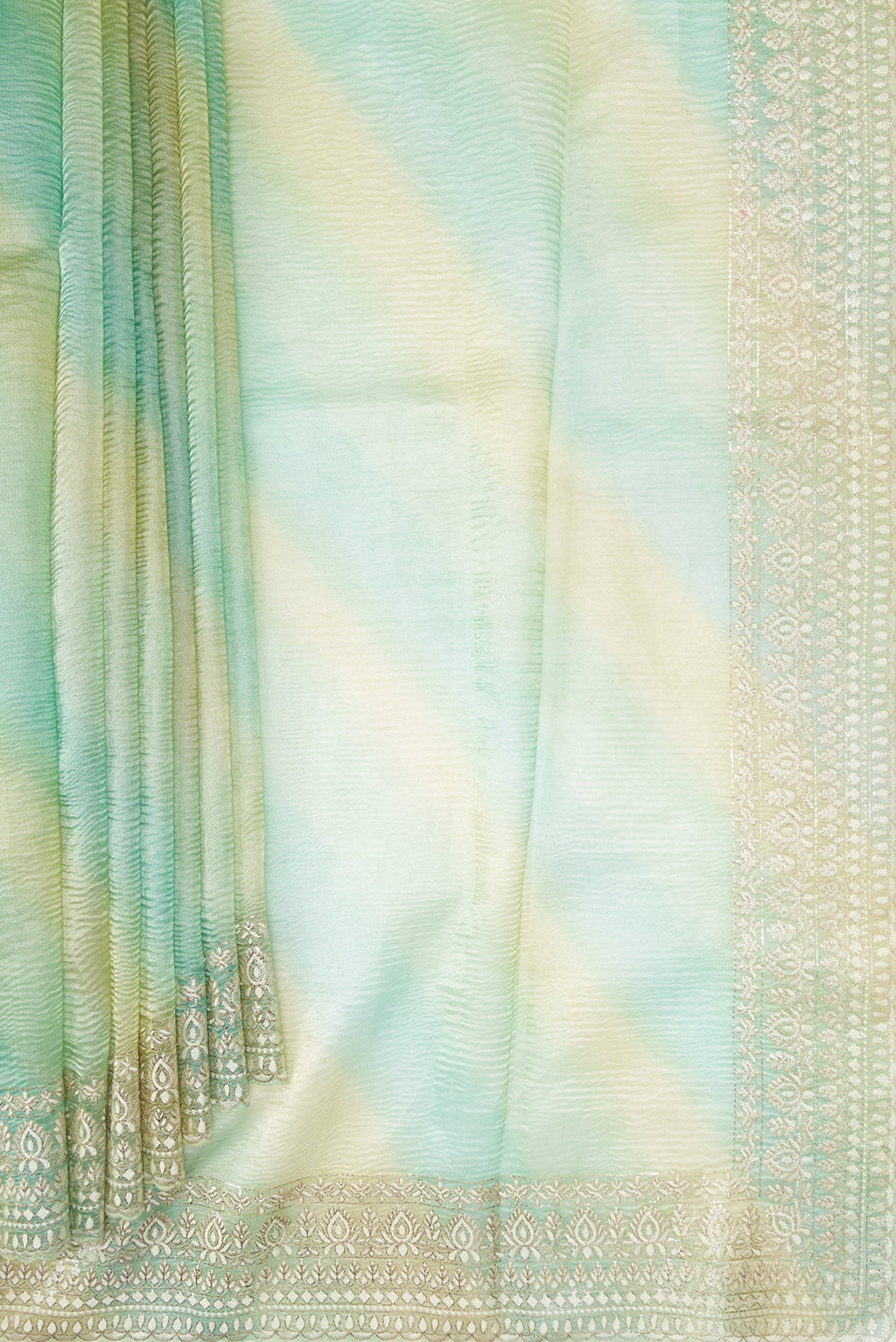 Pleats and pallu of Pista Green Dual Tone Organza Silk Saree with Stripes on the body and Embroidery Border. 