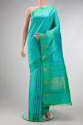 Pure Silk Pure Zari Sea Green Dual Tone Kanjivaram Saree with Jacquard design on the body and Fancy Border.  displayed on a mannequin