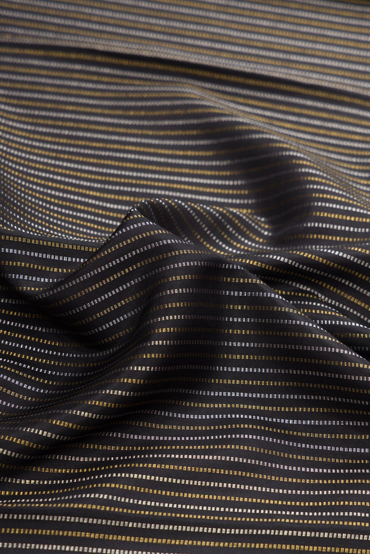 Close up of Pure Silk Pure Zari Black Dual Tone Kanchipuram Saree with Stripes on the body and Zari Border.  displaying folds