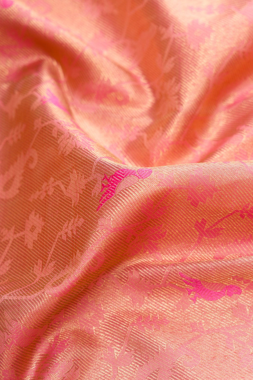 Close up of Pure Silk Pure Zari Pink Dual Tone Kanjivaram Saree with Zari Brocade on the body and Zari Border.  displaying folds