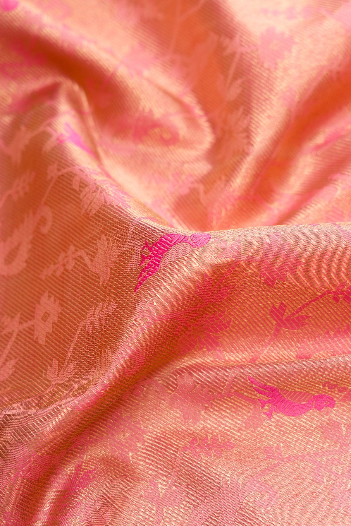Close up of Pure Silk Pure Zari Pink Dual Tone Kanjivaram Saree with Zari Brocade on the body and Zari Border.  displaying folds