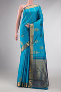 Sky Blue Dual Tone Kanchipuram Silk Saree with Zari Butta on the body and Zari Border displayed on a mannequin