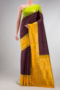 Coffee Brown Dual Tone Kanchipuram Silk Saree with Stripes on the body and Ganga Jamuna Border.  displayed on a mannequin