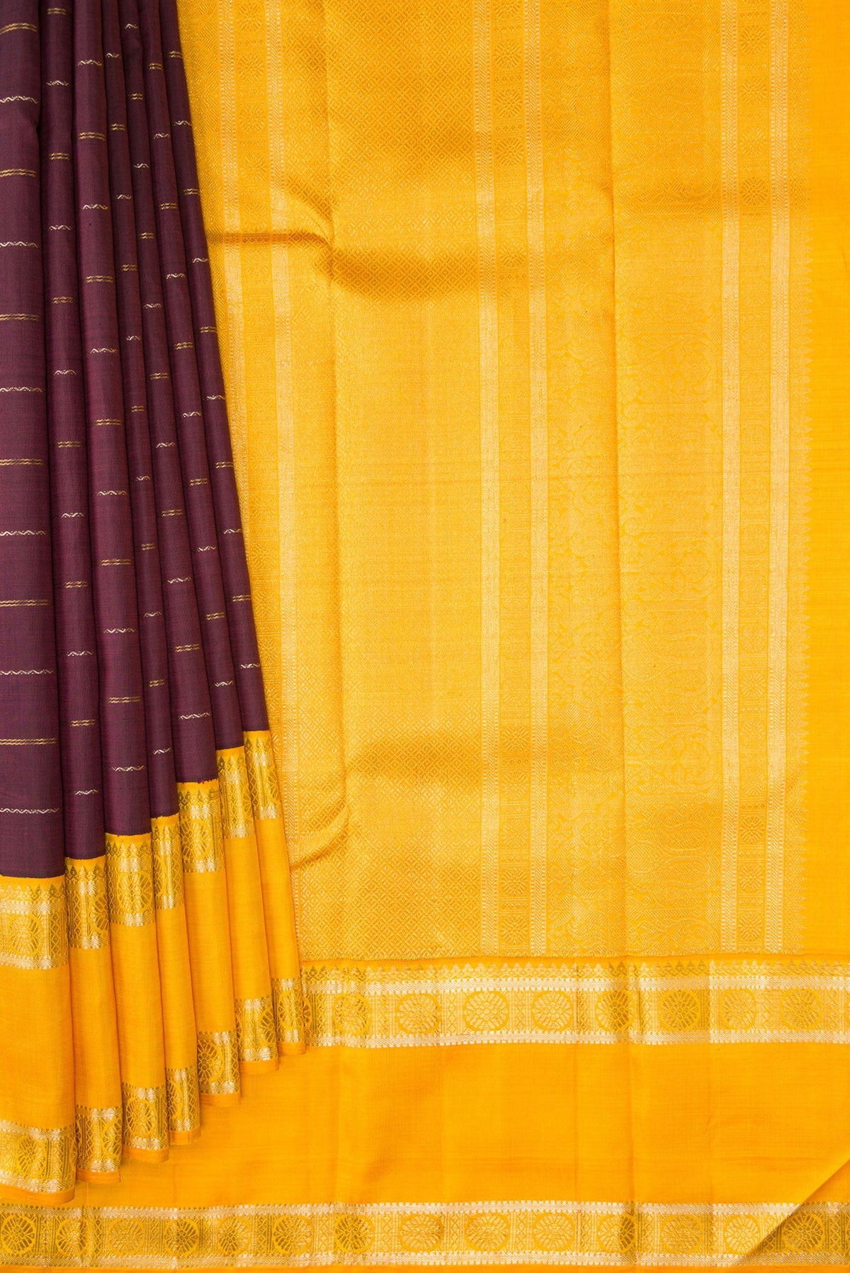 Pleats and pallu of Coffee Brown Dual Tone Kanchipuram Silk Saree with Stripes on the body and Ganga Jamuna Border. 