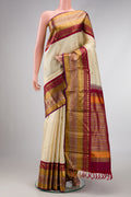 Sandal Dual Tone Kanchipuram Silk Saree with Zari Butta on the body and Zari Border.  displayed on a mannequin