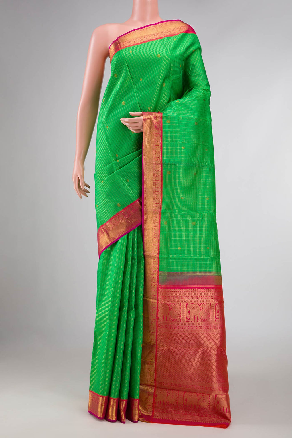 Parrot Green Dual Tone Kanchipuram Silk Saree with Checked design on the body and Zari Border displayed on a mannequin