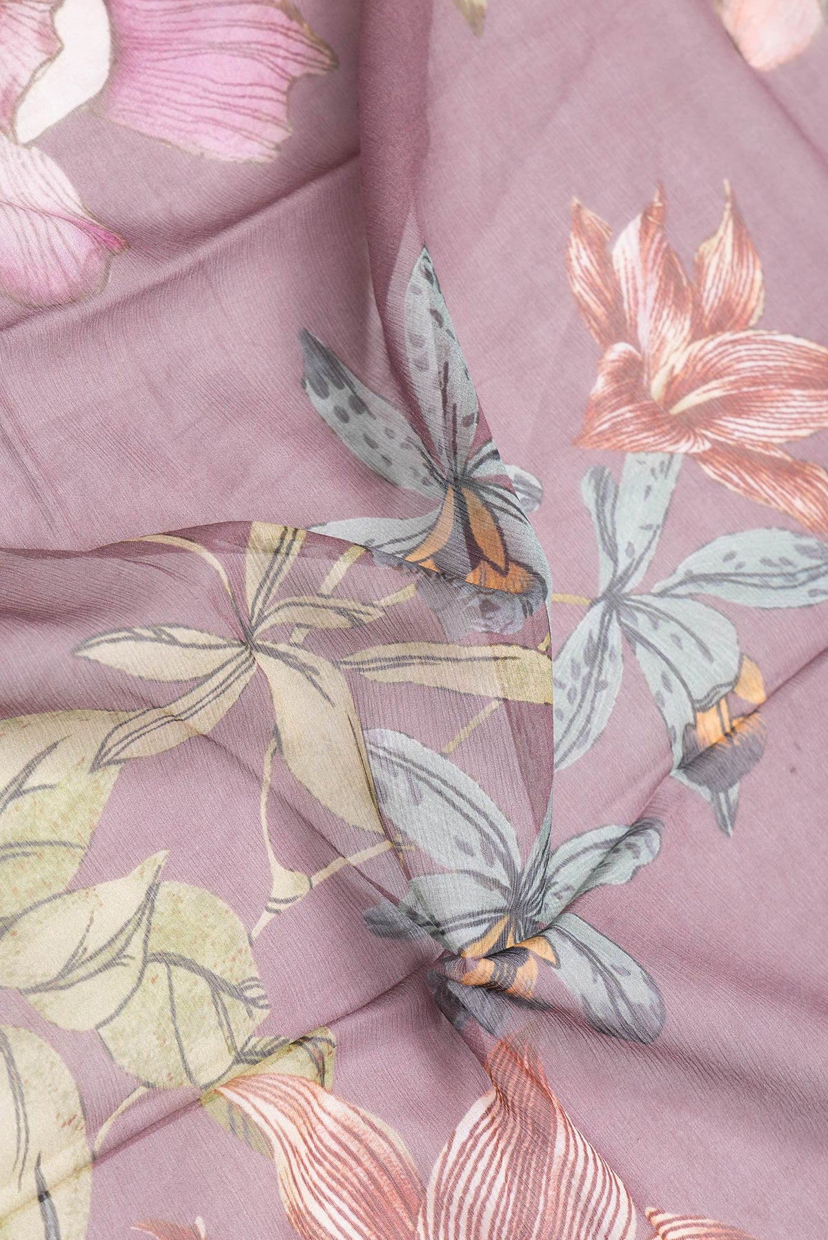 Close up of Purple Dual Tone Chiffon Saree with Printed design on the body and Without Border.  displaying folds