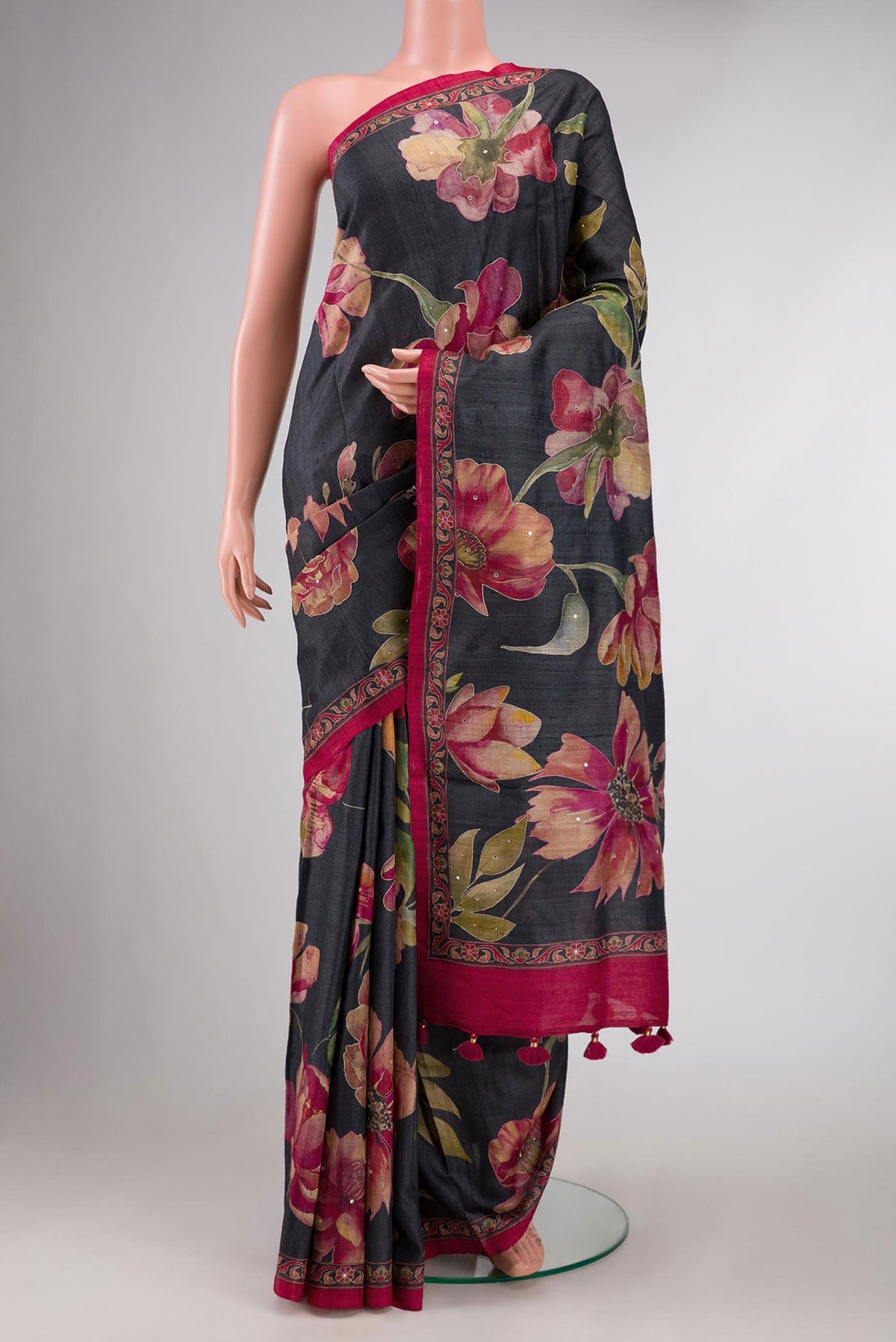 Black Dual Tone Tussar Silk Saree with Embroidery on the body and Embroidery Border displayed on a mannequin