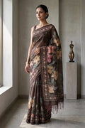 Model wearing a Coffee Brown Tussar Silk SareePrinted design on the body and Printed Border.