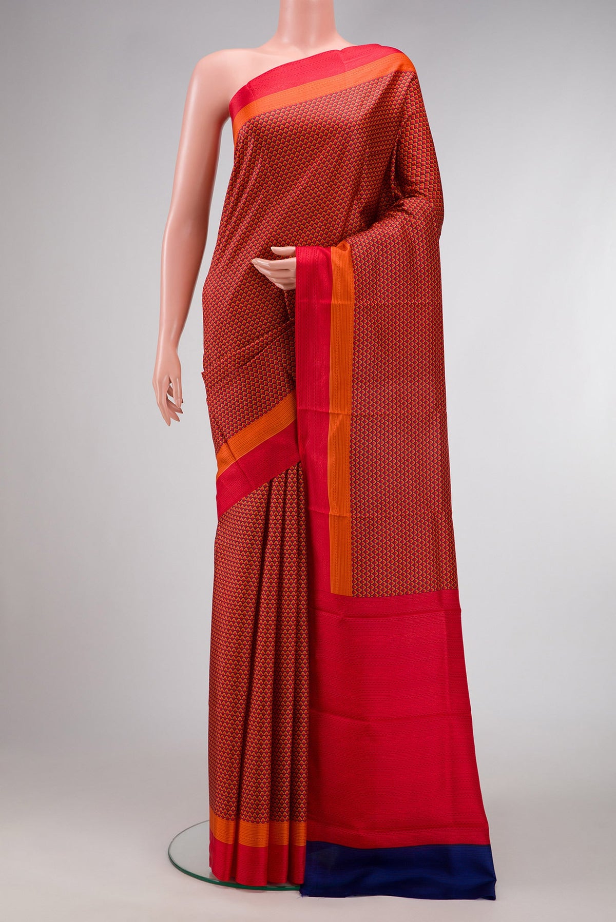 Red Dual Tone Printed Silk Saree with Printed design on the body and Printed Border.  displayed on a mannequin