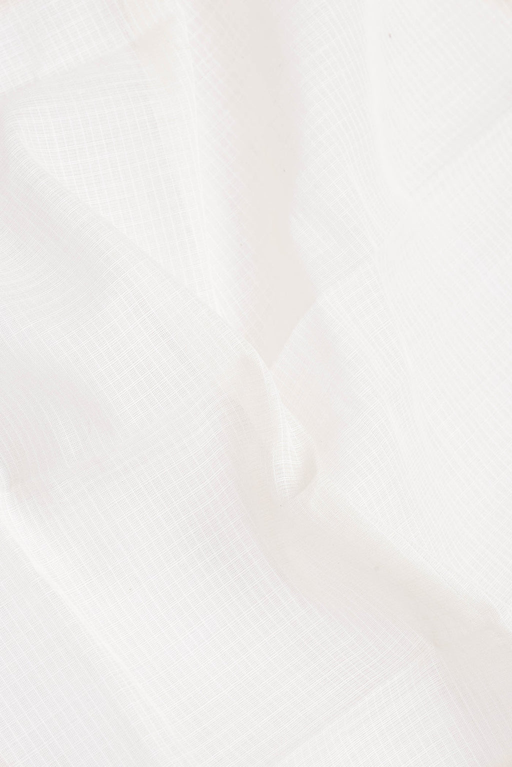 Close up of White Gadwal cotton Saree with Checked design on the body and Zari Border.  displaying folds