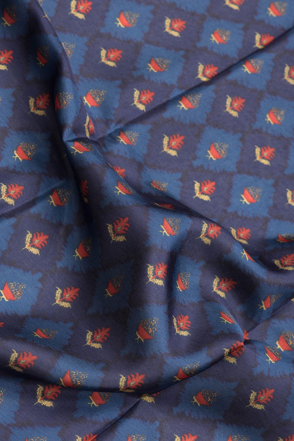 Close up of Navy Blue Dual Tone Printed Silk Saree with Printed design on the body and Plain Border.  displaying folds
