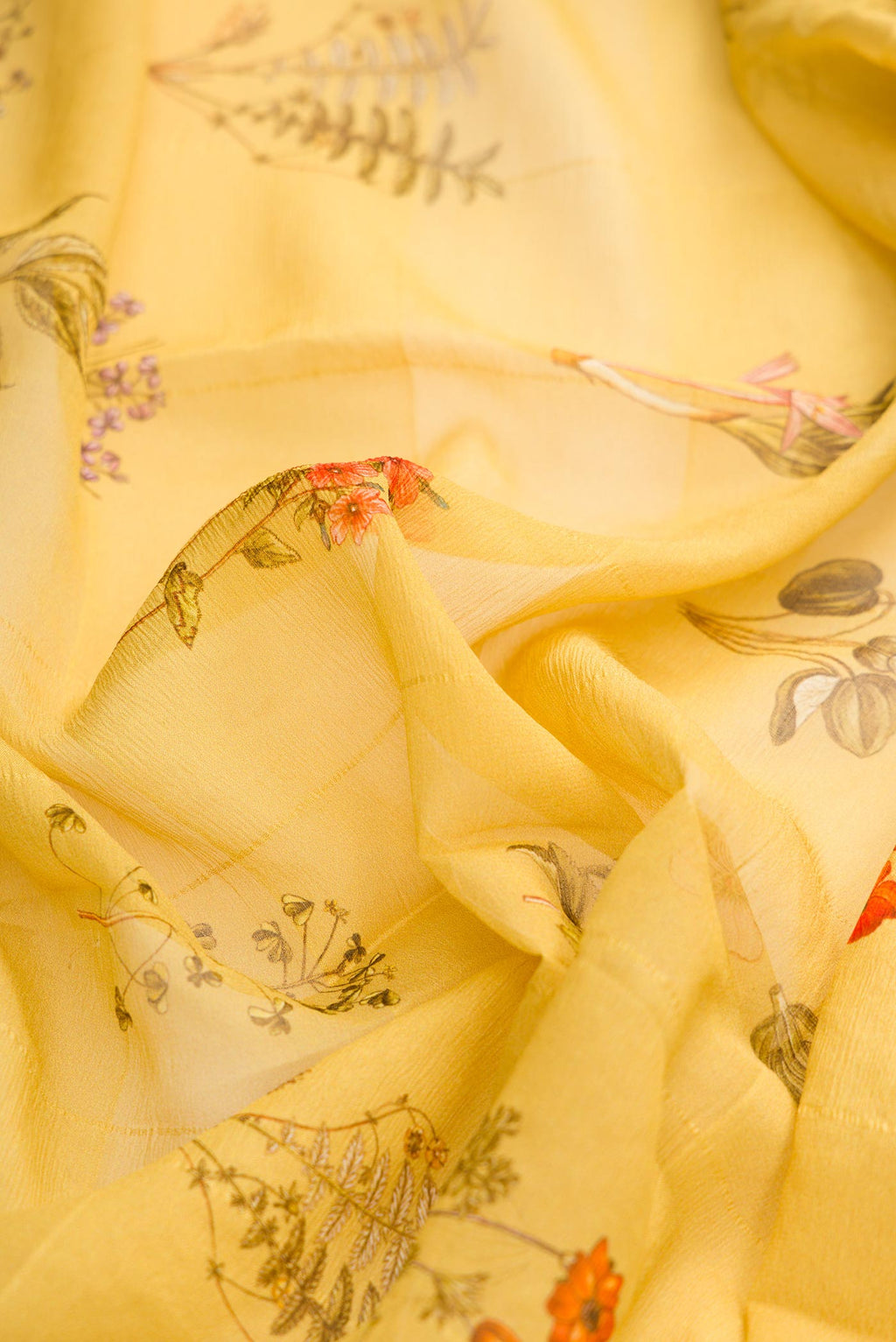 Close up of Mustard Dual Tone Mysore Georgette Saree with Printed design on the body and Zari Border displaying folds