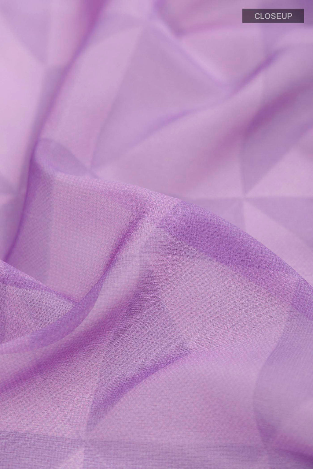 Close up of Lavender Georgette Saree Printed design on the body and Zari Border displaying folds