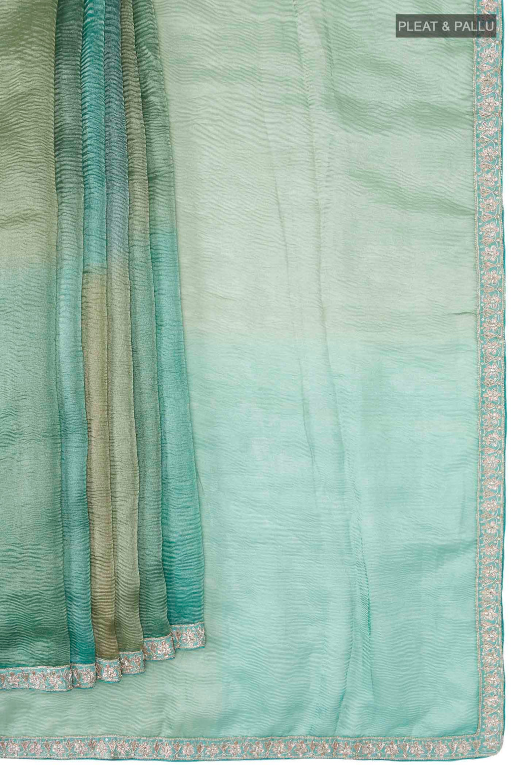 Pleats and pallu of Multi Tissue Silk Saree with Plain Body and Embroidery Border