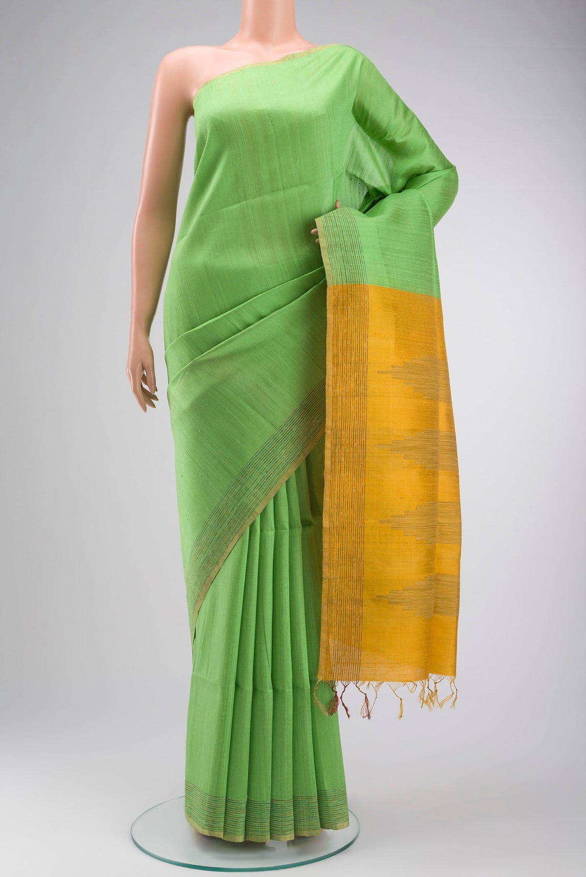 Pista Green Raw Silk Saree with Plain Body and Thread Border displayed on a mannequin
