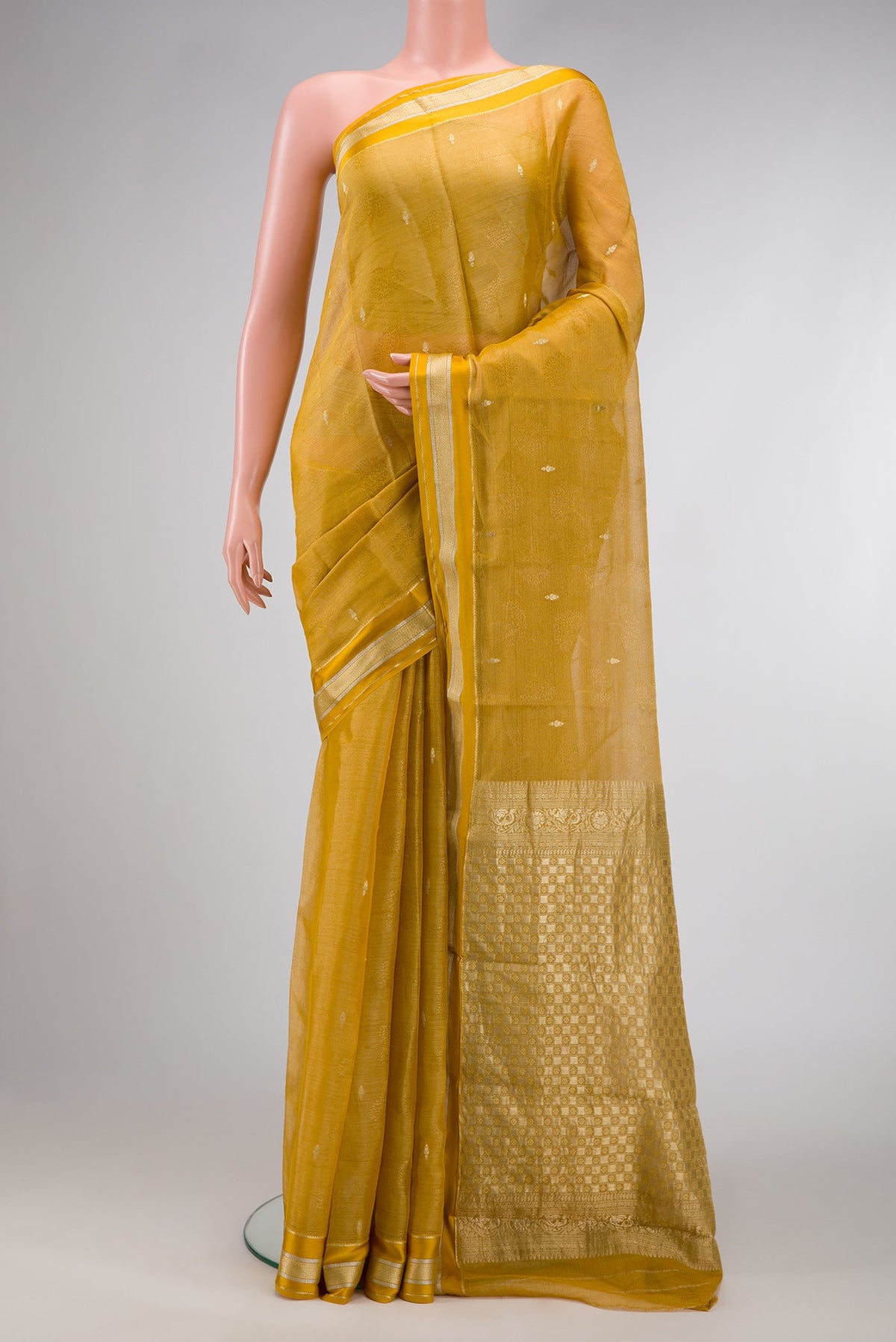 Mustard Dual Tone Mysore Georgette Saree with Zari Brocade on the body and Zari Border.  displayed on a mannequin