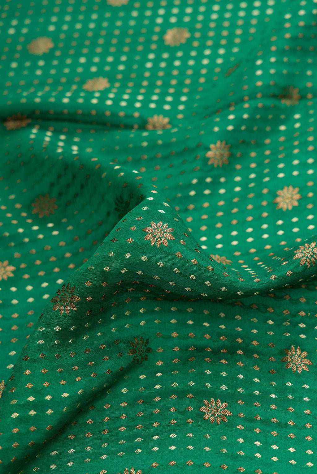 Close up of Bottle Green Dual Tone Banarasi Georgette Saree with Stripes on the body and Zari Border.  displaying folds