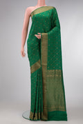 Bottle Green Dual Tone Banarasi Georgette Saree with Stripes on the body and Zari Border.  displayed on a mannequin