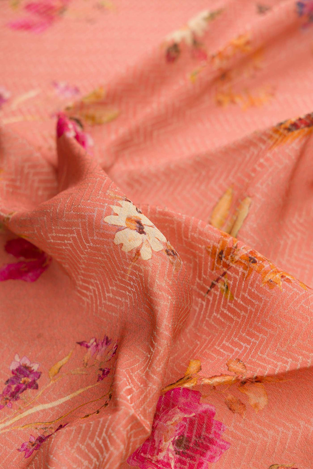 Close up of Rose Gold Dual Tone Mysore Georgette Saree with Zari Brocade on the body and Zari Border displaying folds