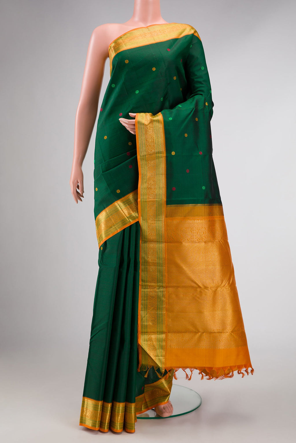 Bottle Green Dual Tone Kanchipuram Silk Saree with Thread Butta on the body and Zari Border displayed on a mannequin