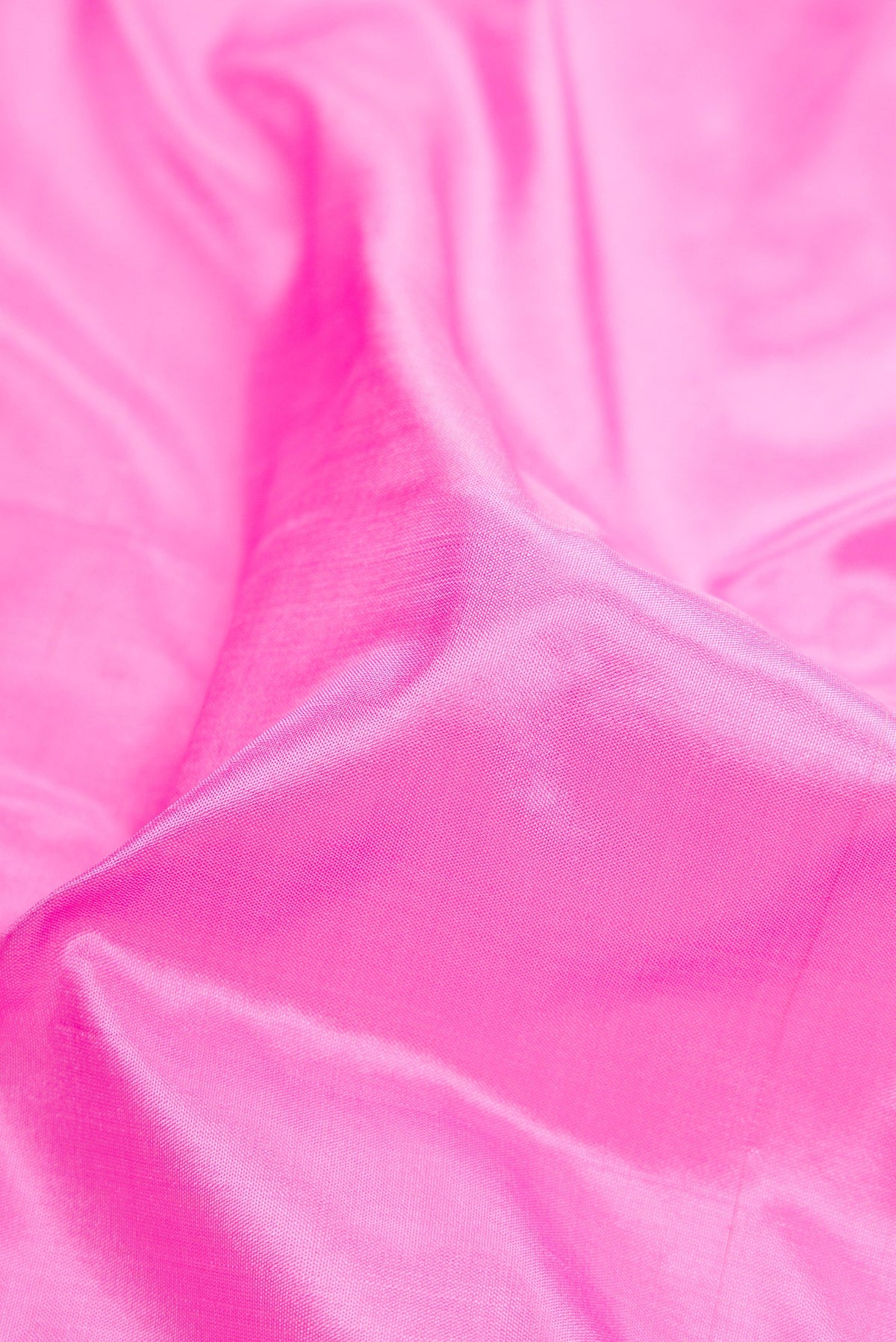 Close up of Pink Dual Tone Kanchipuram Silk Nine Yards Saree with Plain Body and Zari Border.  displaying folds