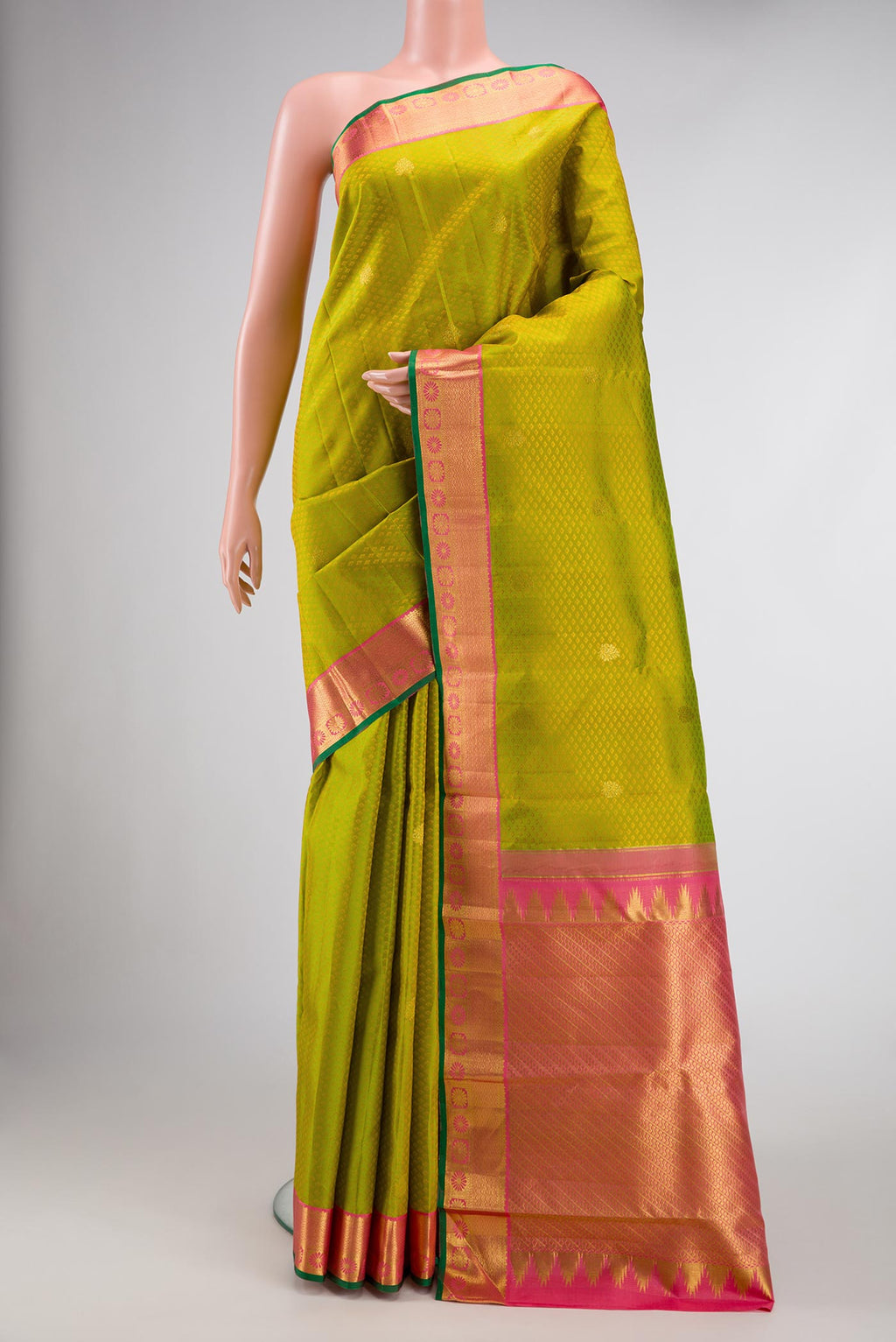 Parrot Green Dual Tone Kanjivaram Silk Saree with Jacquard With Zari Butta on the body and Zari Border.  displayed on a mannequin