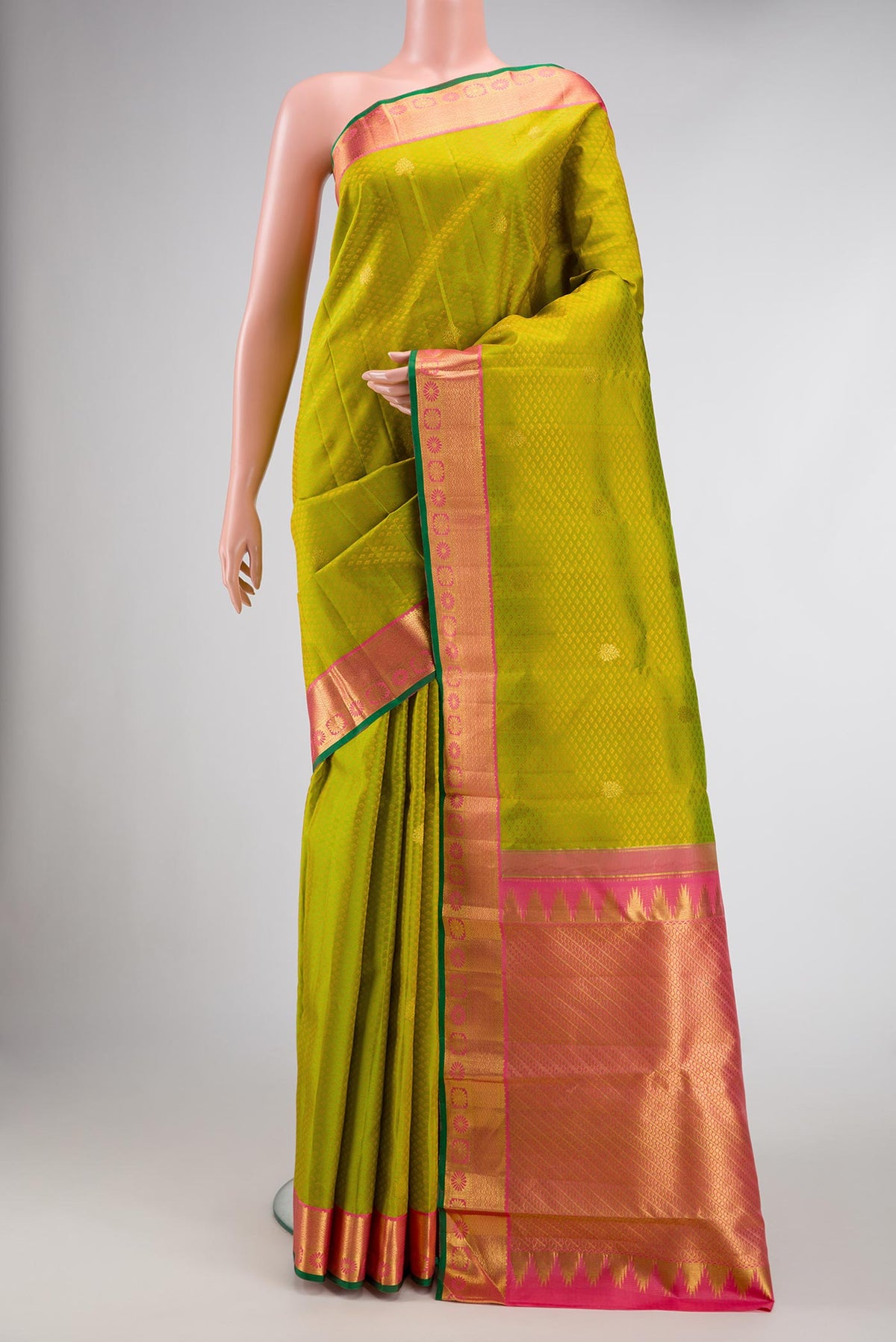 Parrot Green Dual Tone Kanjivaram Silk Saree with Jacquard With Zari Butta on the body and Zari Border.  displayed on a mannequin
